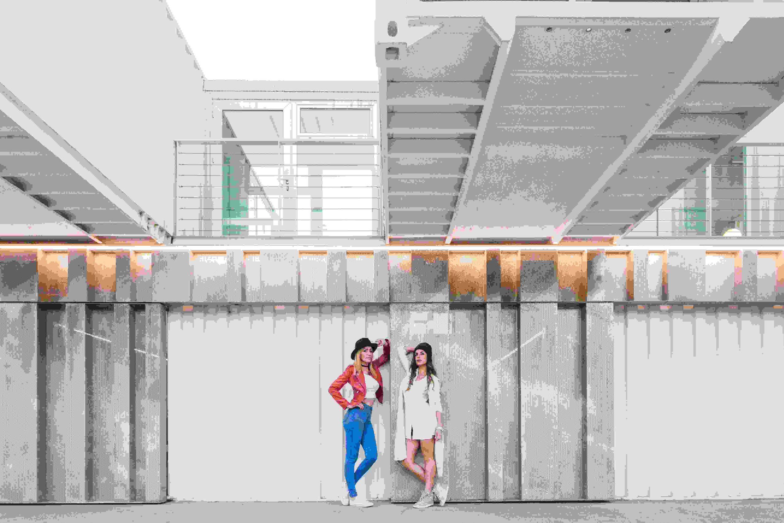 1-yong-women-posing-near-modern-modular-building