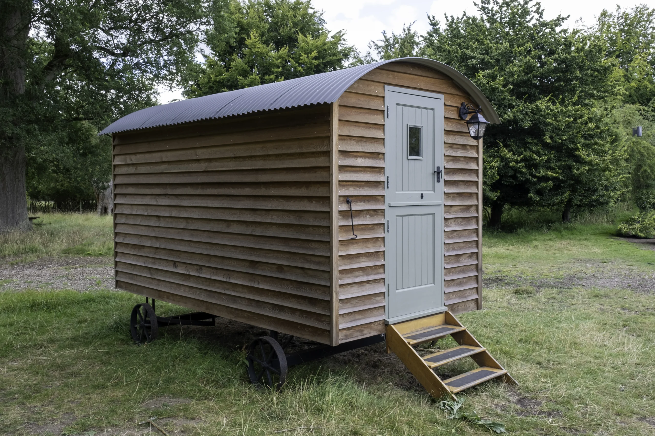 1-closeup-shot-small-wooden-house-wheels
