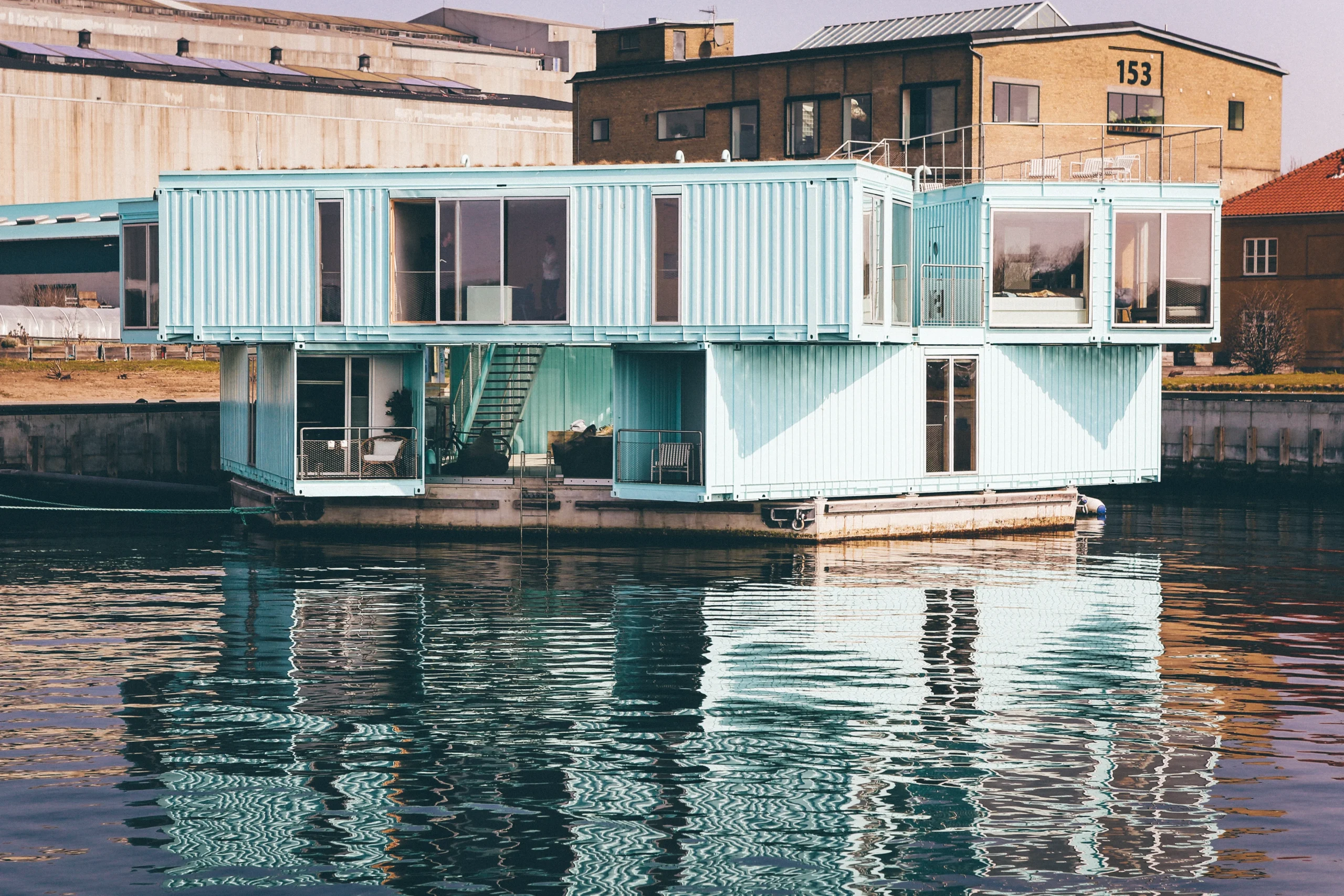 1-large-shot-light-blue-house-dock-body-water